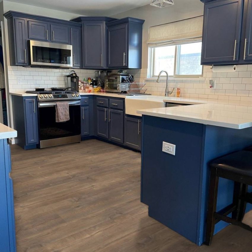 Quick-Step Reclaime Waterproof Collection: Mocha Oak Planks 12mm Laminate UF1578W Room Scene